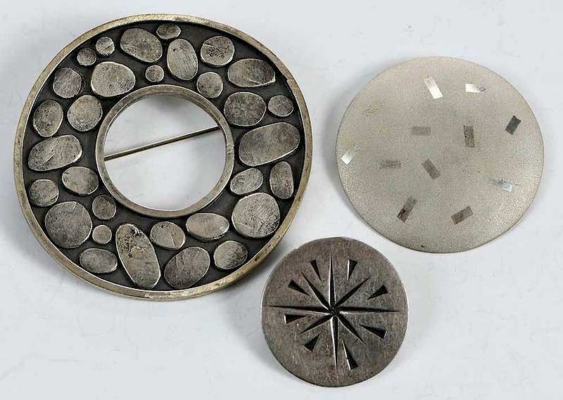 Appraisal: Three Sterling Brooches circular assorted stamps to in gramsProvenance Estate