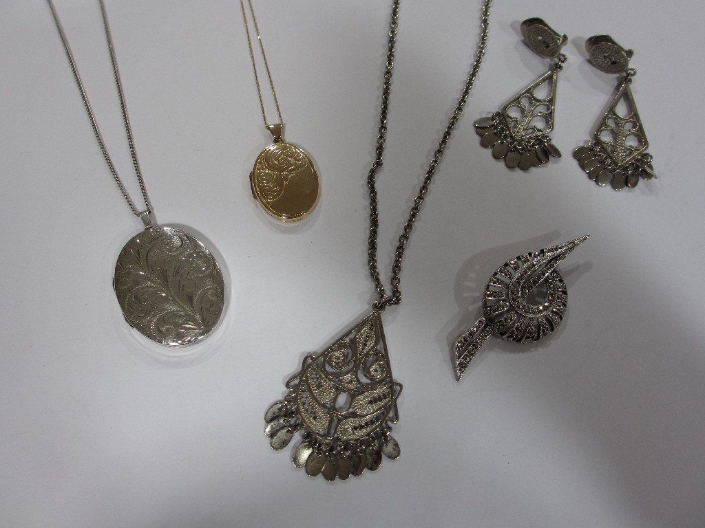 Appraisal: Lot comprising a ct gold locket gms silver locket marcasite