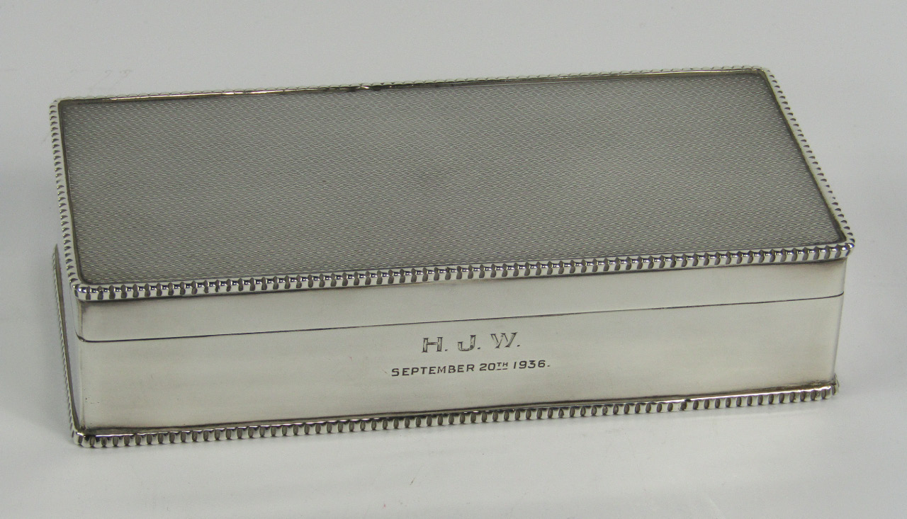 Appraisal: A George V silver twin division cigarette box with engine