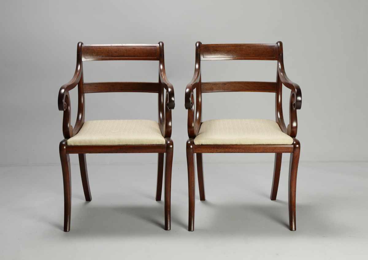 Appraisal: Pair of Early th Cent Mahogany Arm Chairs Sabre legs