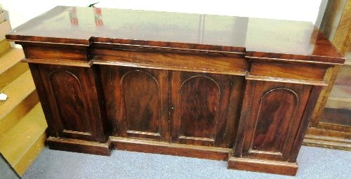 Appraisal: A Victorian mahogany breakfront sideboard fitted three drawers to the