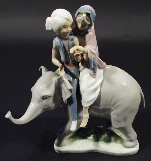 Appraisal: Lladro porcelain figure group of two Indian children on elephants