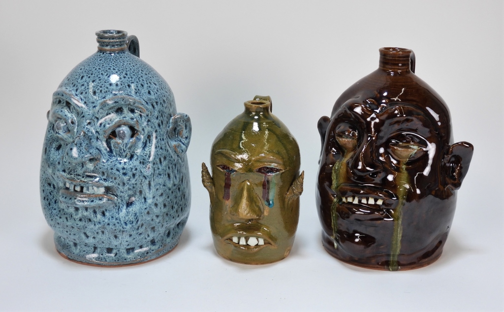 Appraisal: PC MARVIN BAILEY WAYNE HEWELL POTTERY FACE JUGS United States