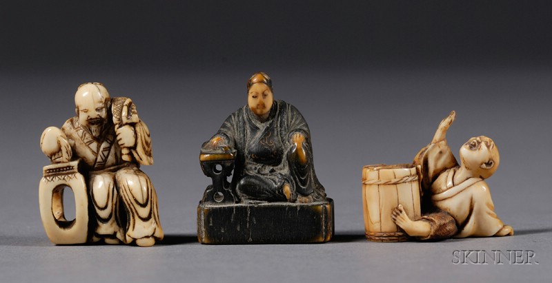 Appraisal: Three Ivory Netsuke th th century a seated figure of