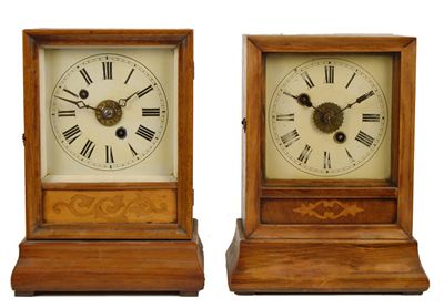 Appraisal: A German walnut mantel clock with alarm the two barrel