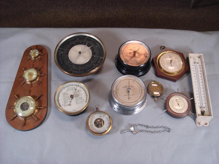 Appraisal: Group of aneroid thermometers and barometers and car clock Estimate