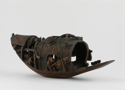 Appraisal: A Chinese bamboo model of a boat carved with four