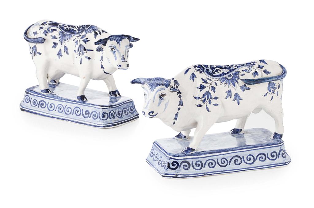 Appraisal: NEAR PAIR OF DELFT FIGURES OF COWS TH CENTURY each