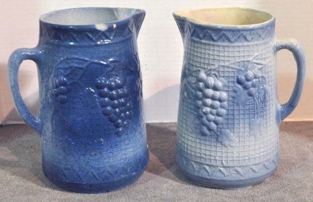 Appraisal: Two Blue White Salt Glazed Stoneware PitchersIn grape and leaf