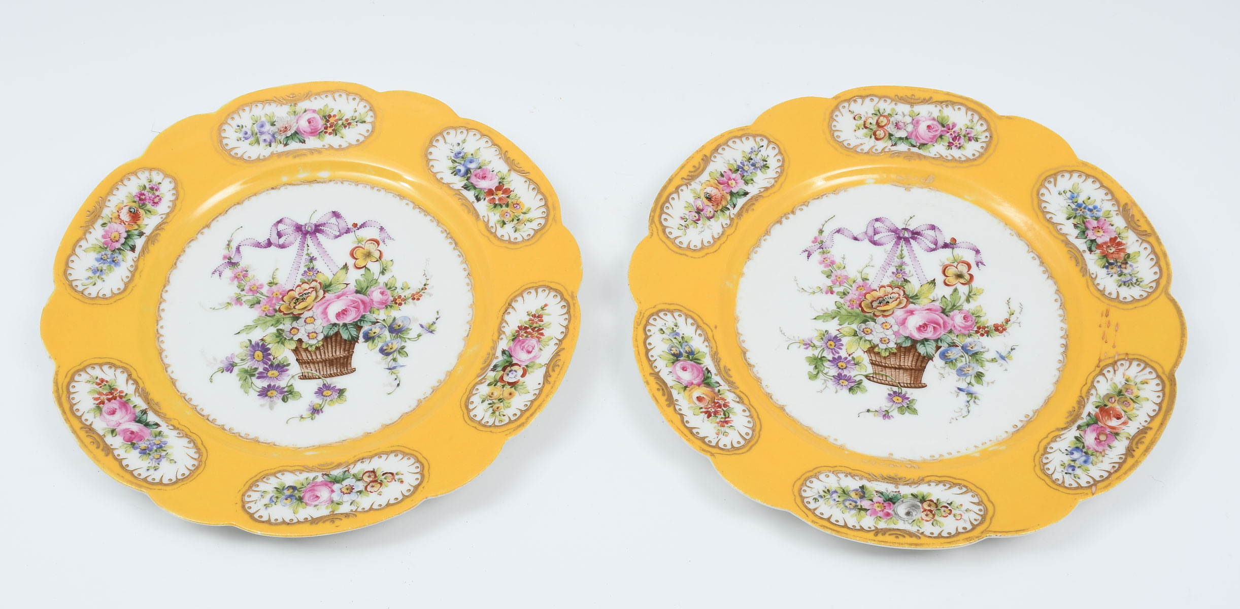 Appraisal: SEVRES YELLOW GROUND PLATES Pair of th century enameled French