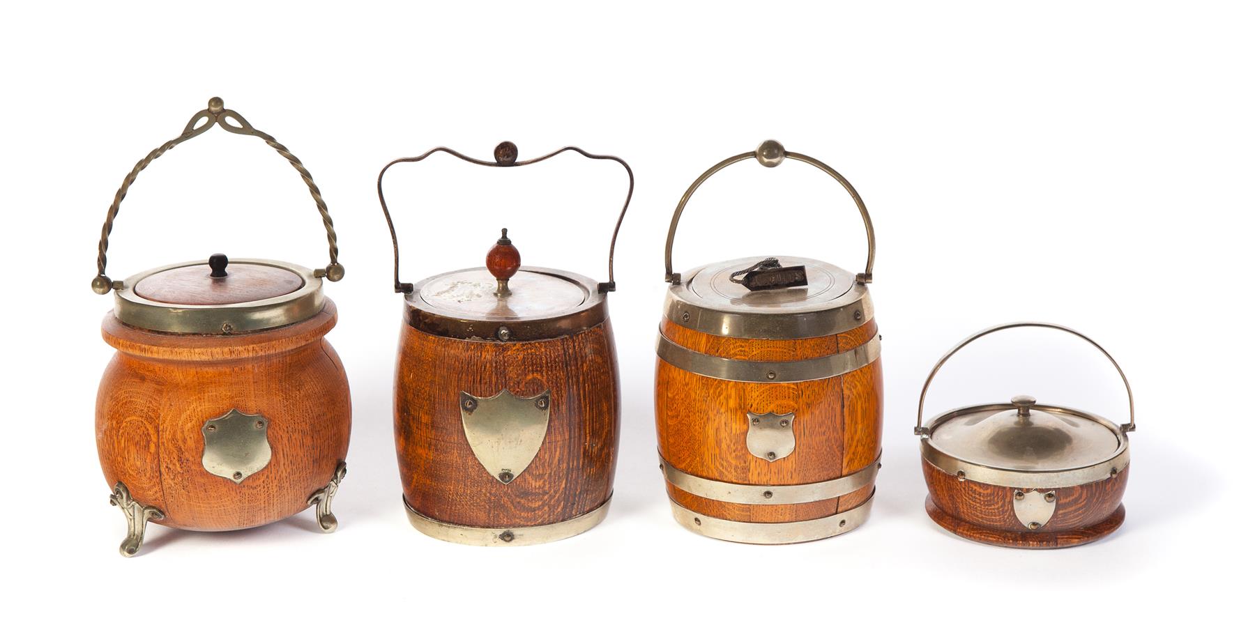 Appraisal: FOUR OAK BARREL-SHAPE BISCUIT JARS England late th century All