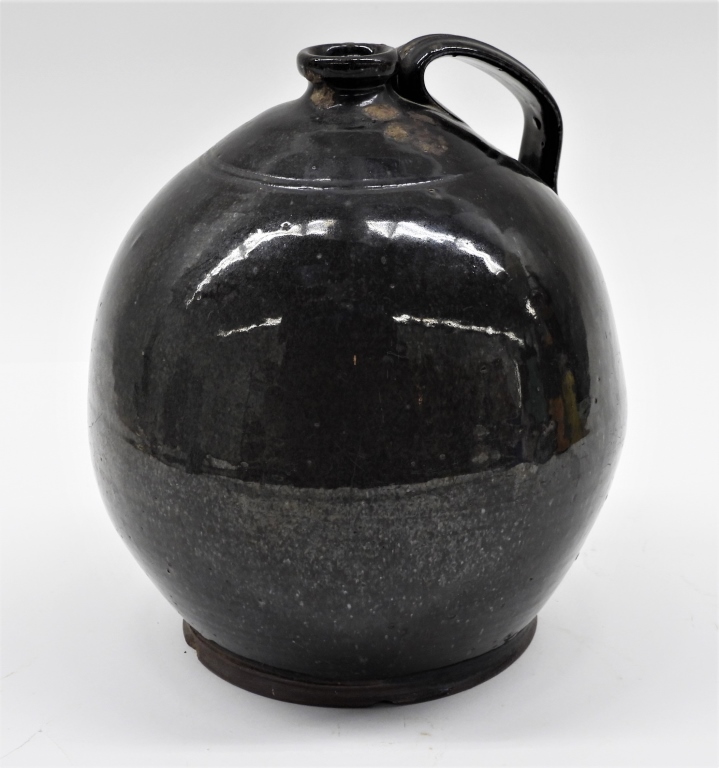 Appraisal: LG DARK GLAZE HANDLED REDWARE JUG United States Late th-