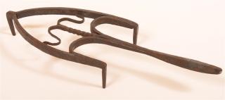 Appraisal: th th Century Wrought Iron Trivet Shield shaped and ram's