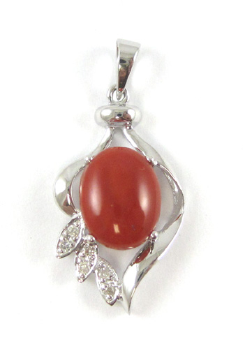 Appraisal: CORAL DIAMOND AND WHITE GOLD PENDANT The k gold pendant