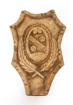 Appraisal: An alabaster panel of cartouche shape with central armorial above