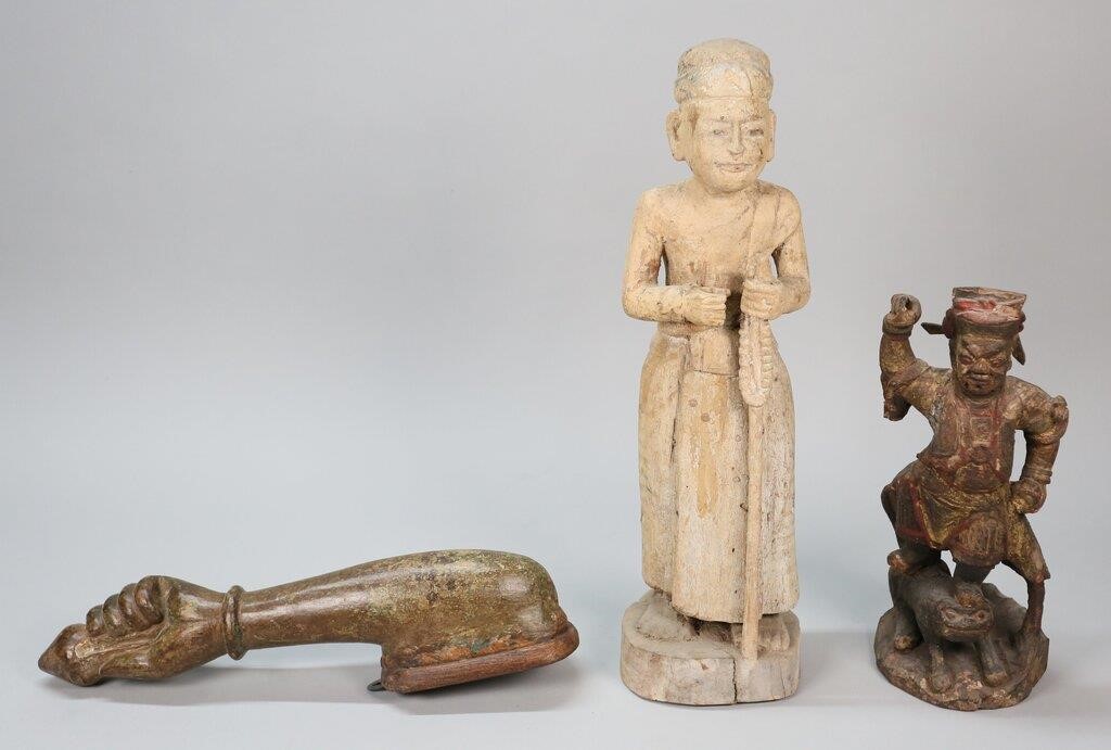 Appraisal: Chinese deity standing on animal remnants of red and gold