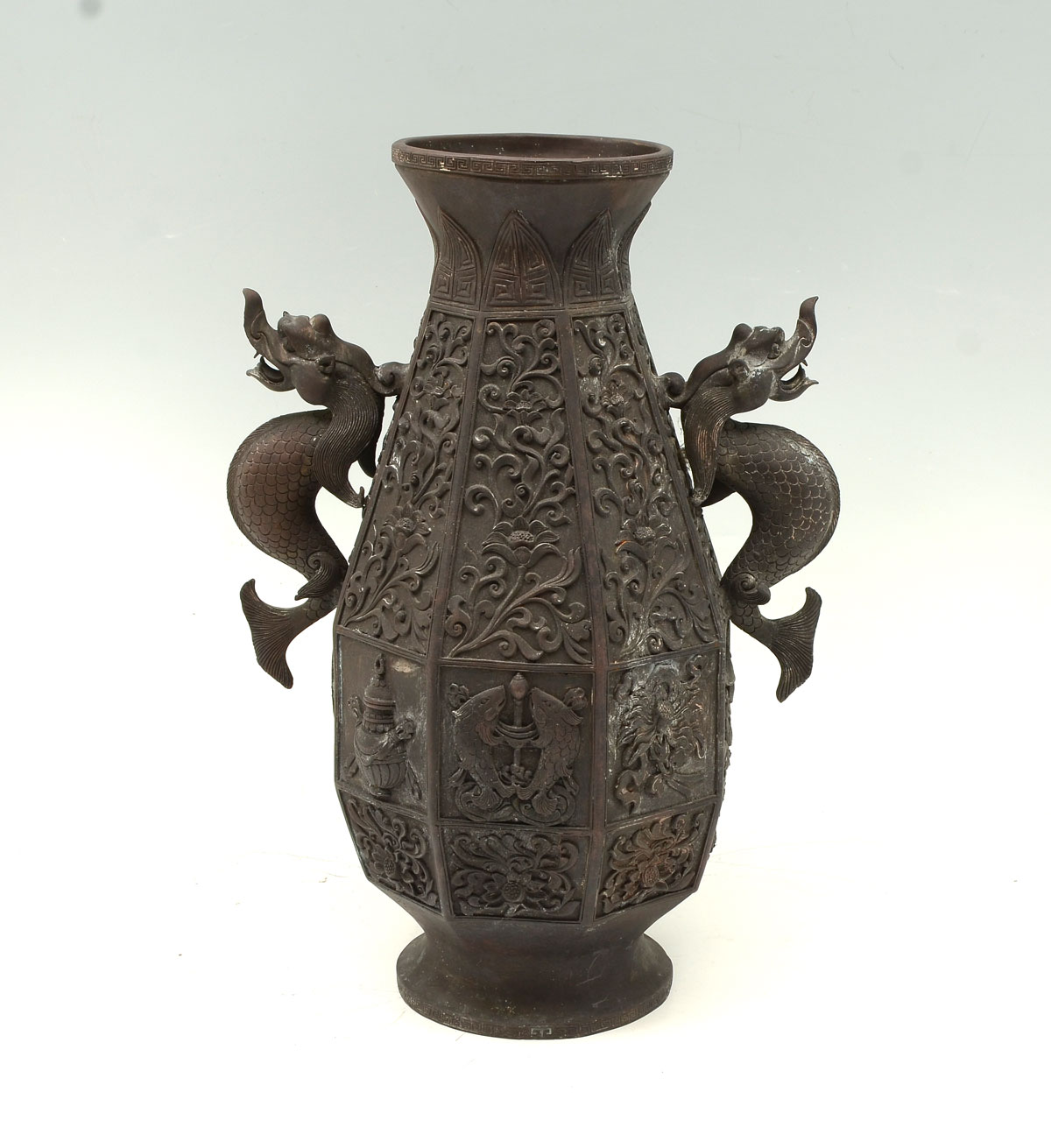 Appraisal: QING DYNASTY OCTAGONAL BUDDHIST BRONZE VASE Chinese Buddhist octagonal bronze