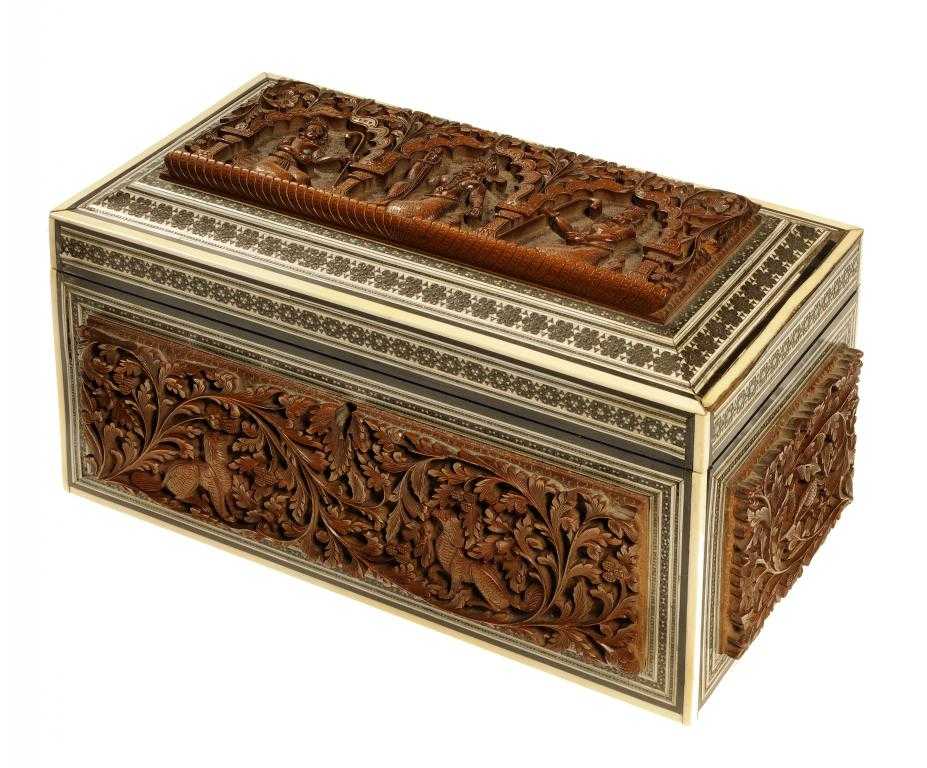 Appraisal: AN INDIAN CARVED SANDALWOOD EBONY IVORY AND SADELI TEA CADDY