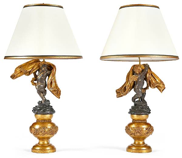 Appraisal: A pair of Italian Baroque painted parcel ebonized and giltwood