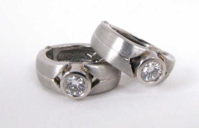 Appraisal: Ladies Platinum and Bezel Set Diamond ''Huggy'' style Earrings