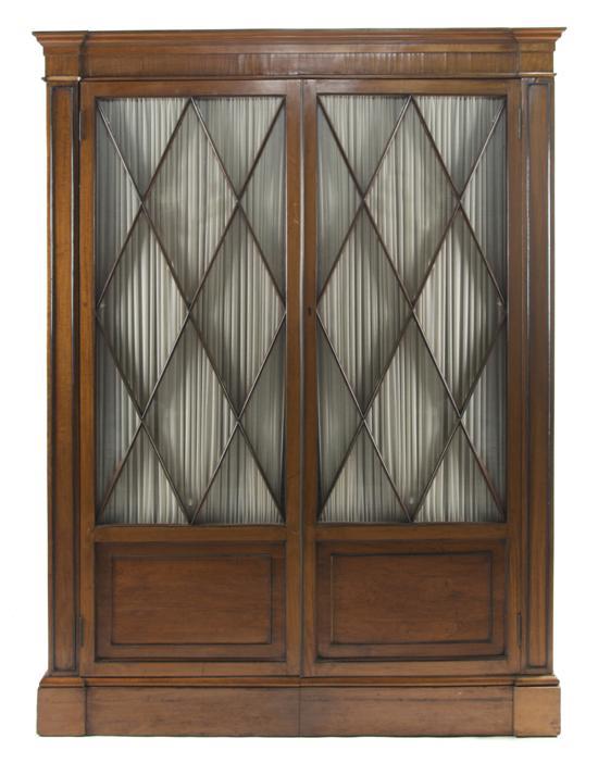 Appraisal: Continental Satinwood and Ebony Bookcase Cabinet having inlaid ebony stringing