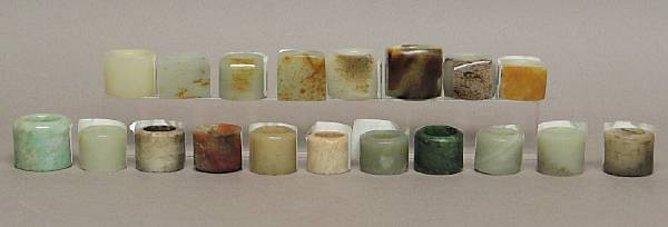 Appraisal: A group of nineteen jade and hardstone archer's rings Including