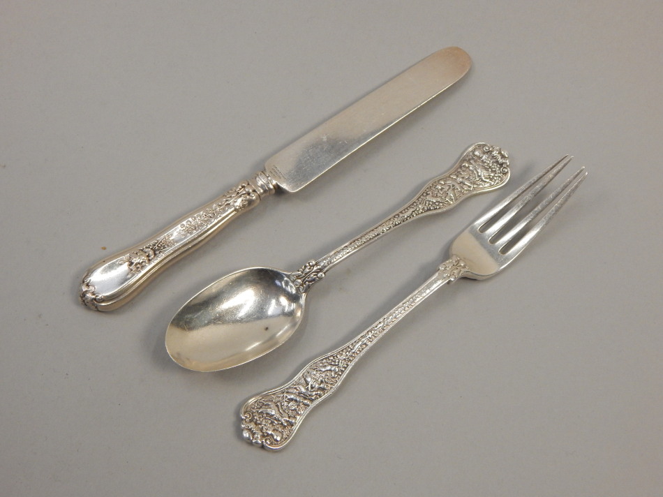 Appraisal: An American white metal christening set comprising spoon fork and