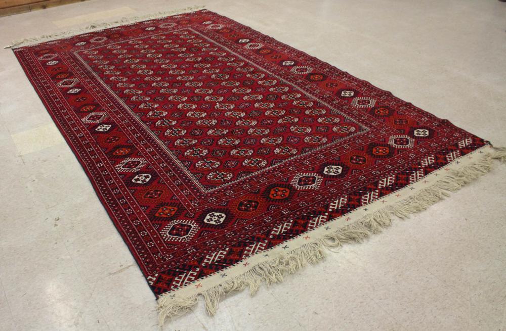 Appraisal: HAND KNOTTED TURKMAN BOKHARA CARPET overall geometric gol design on