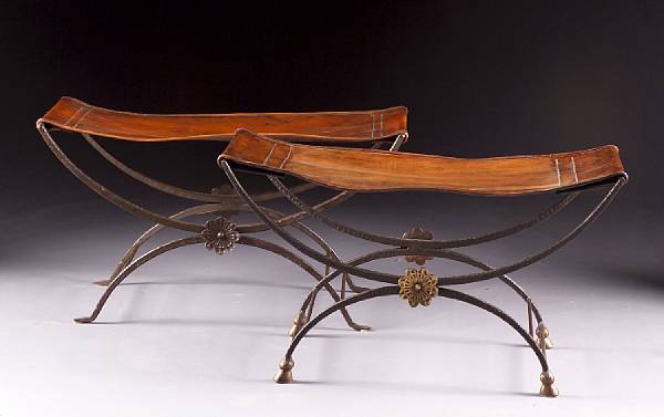 Appraisal: Each with rectangular brown leather seat on a curule form