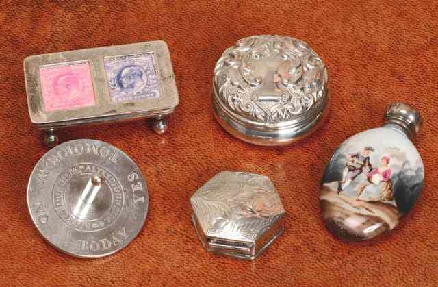 Appraisal: A SILVER DESK TOP STAMP HOLDER with two pierced apertures