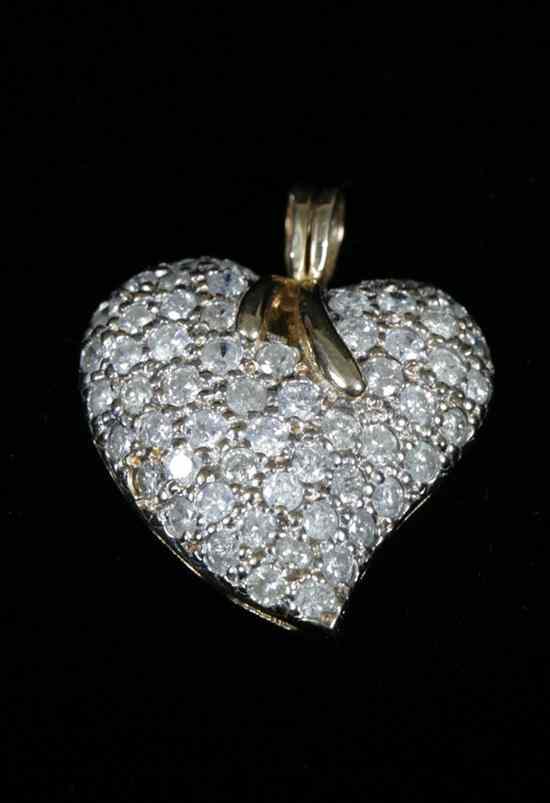 Appraisal: YELLOW GOLD AND DIAMOND STYLIZED HEART PENDANT Heart pave-set with