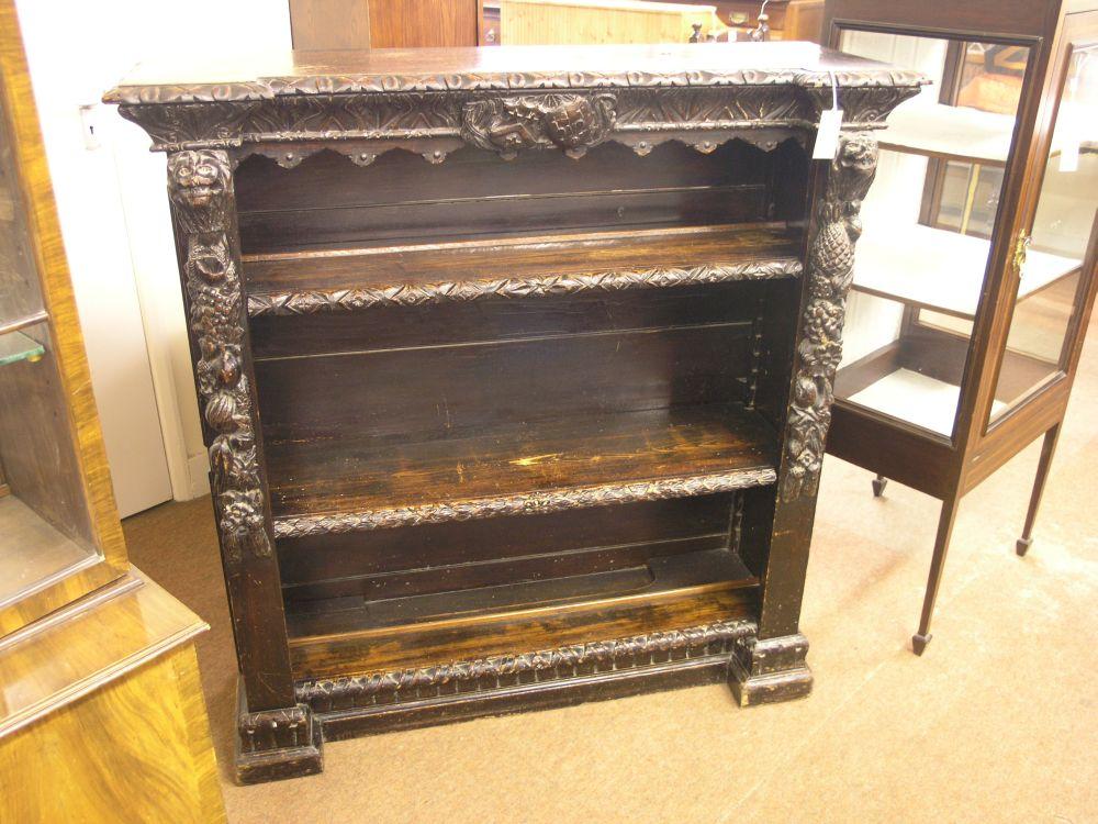 Appraisal: A late Victorian dark carved pine bookcase carved with lion