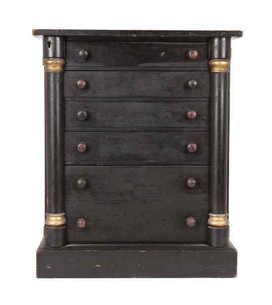 Appraisal: An Ebonized Pine Wellington Case having a rectangular top over