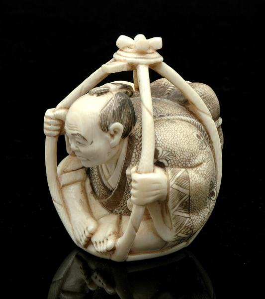 Appraisal: A CARVED IVORY FIGURE th Century Depicting a sitting Japanese