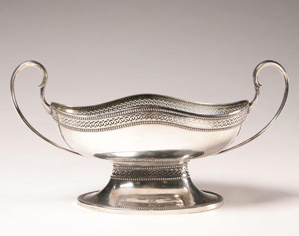 Appraisal: German silver double handled centerpiece with pierced scroll design on