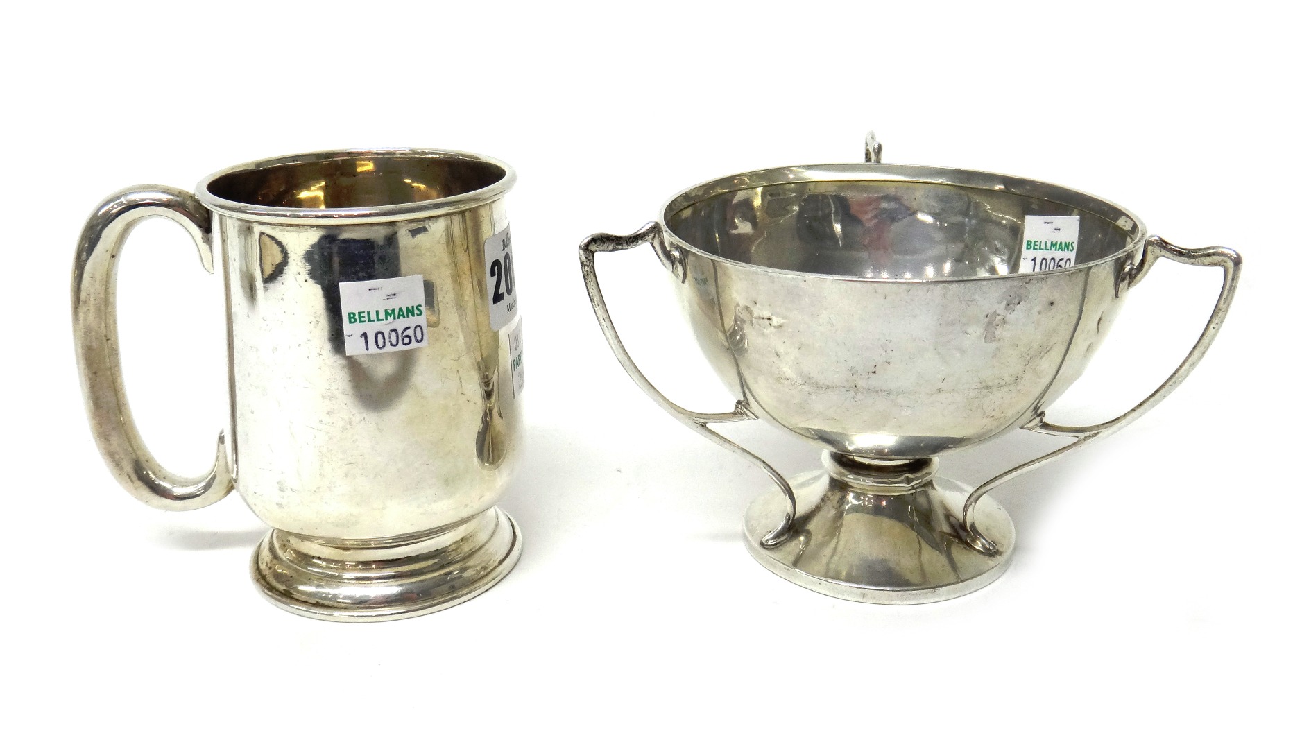 Appraisal: Silver comprising a mug with a 'C' shaped handle on