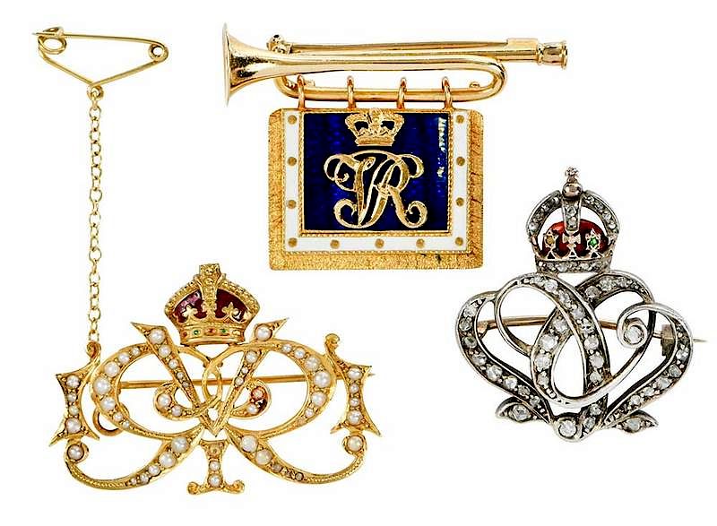 Appraisal: Three Gold Brooches silver topped gold initial British regimental brooch