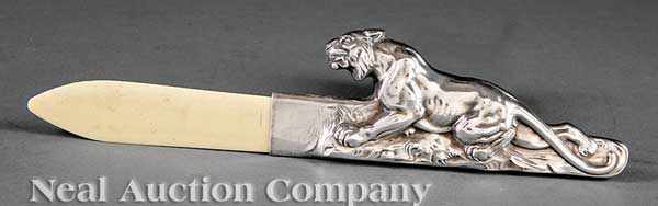 Appraisal: A Continental Silver and Ivory Lion-Form Letter Opener marked FS