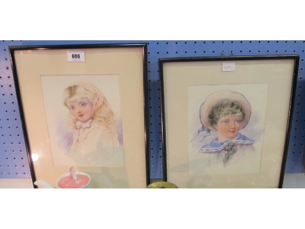 Appraisal: Pair of watercolour portraits of a boy and girl indistinctly