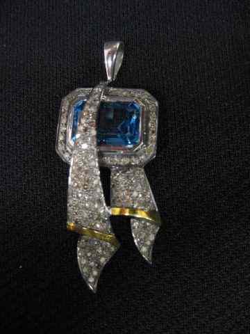 Appraisal: Blue Topaz Diamond Pendant carat gem surrounded by diamonds totaling