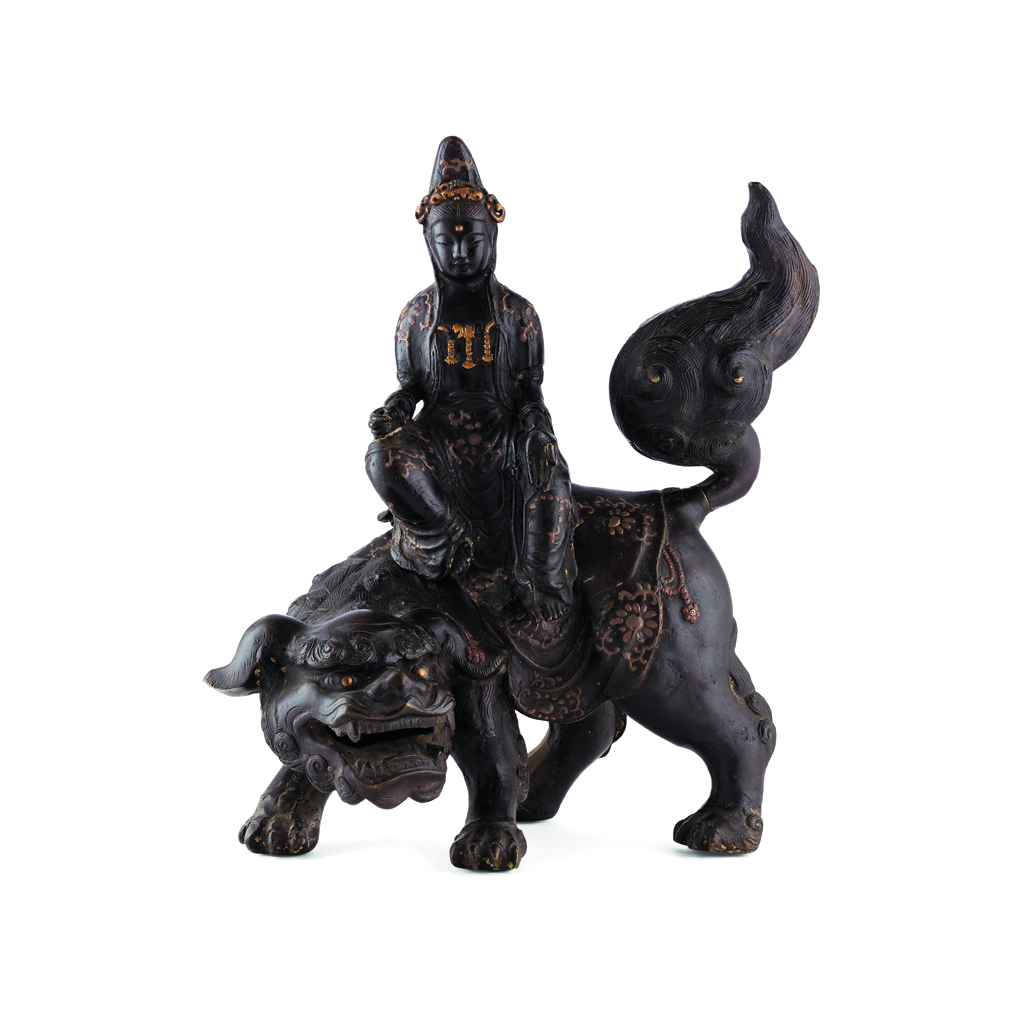 Appraisal: BRONZE FIGURAL GROUP OF GUANYIN ON A BUDDHIST LION MING