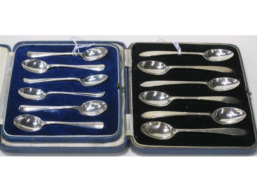 Appraisal: Lot comprising two cased sets of six silver spoons Sheffield