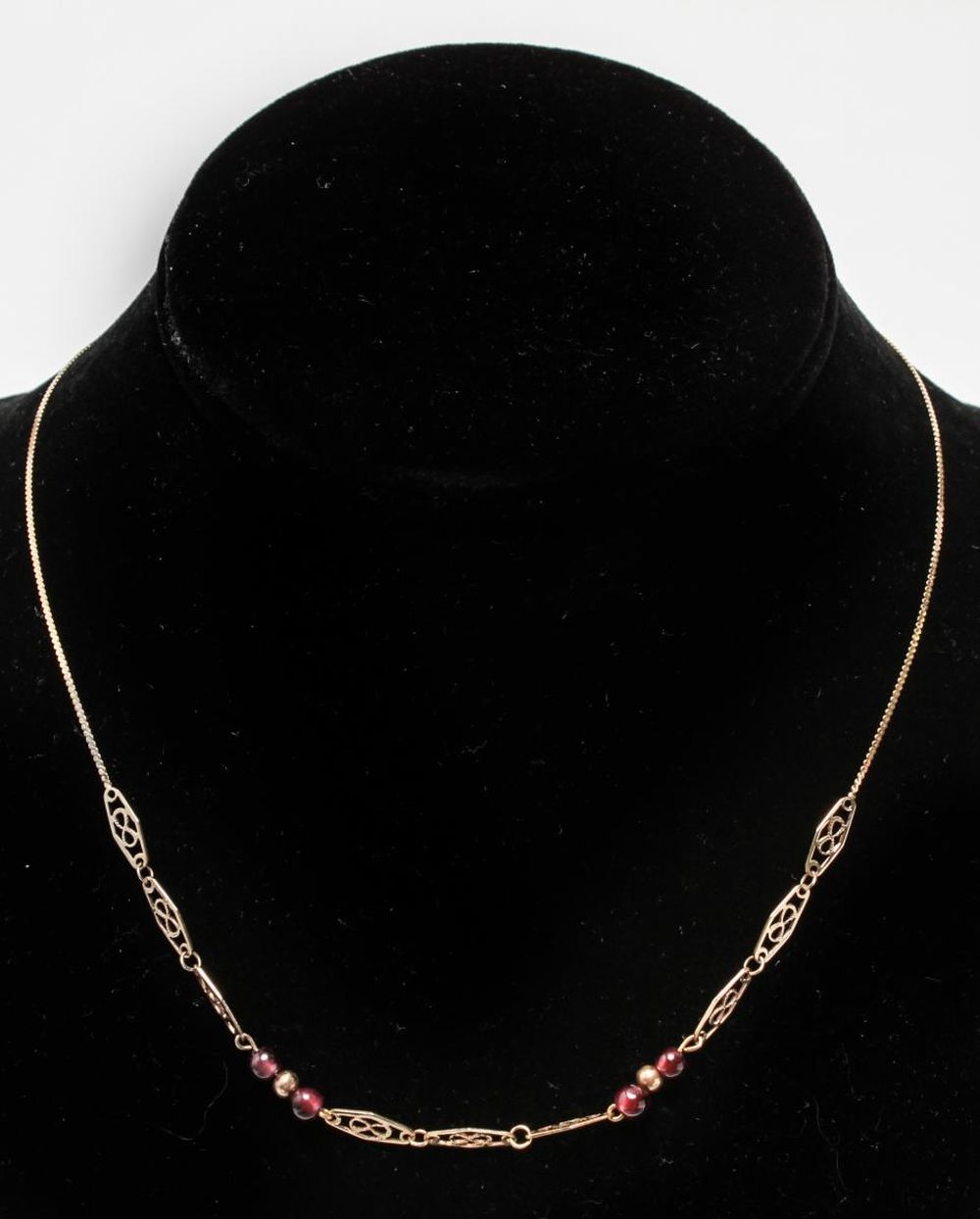 Appraisal: K GOLD GARNET BEADS PIERCED LINK NECKLACE K yellow gold