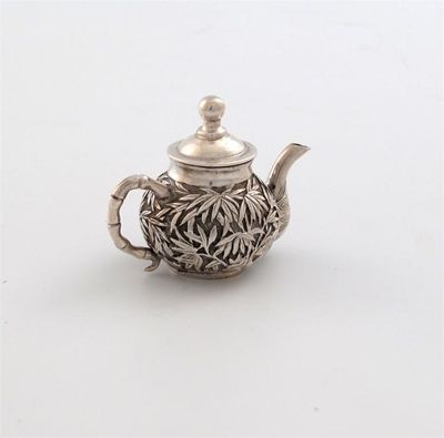 Appraisal: A Chinese miniature silver tea pot marked with Chinese characters