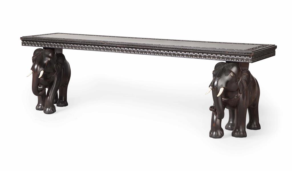 Appraisal: YANGLO-INDIAN CARVED ELEPHANT EBONY BENCH LATE TH CENTURY the long