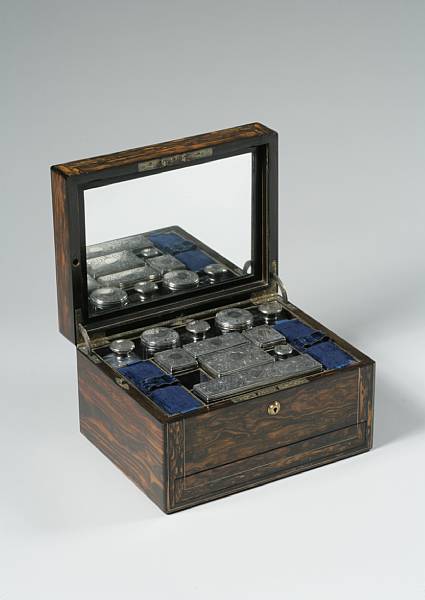 Appraisal: A Victorian calamander dressing case Circa The interior fittings with