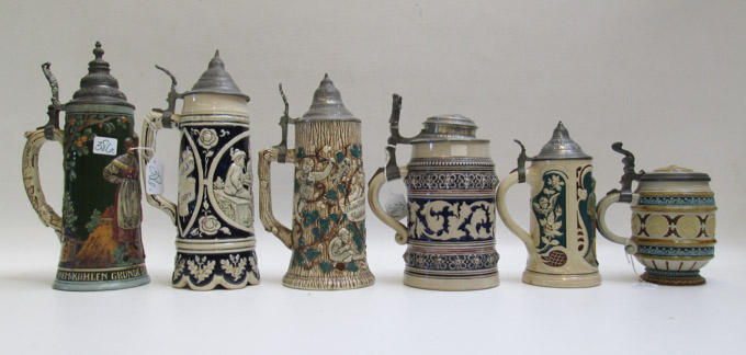 Appraisal: COLLECTION OF SIX GERMAN POTTERY STEINS each with colorful motifs