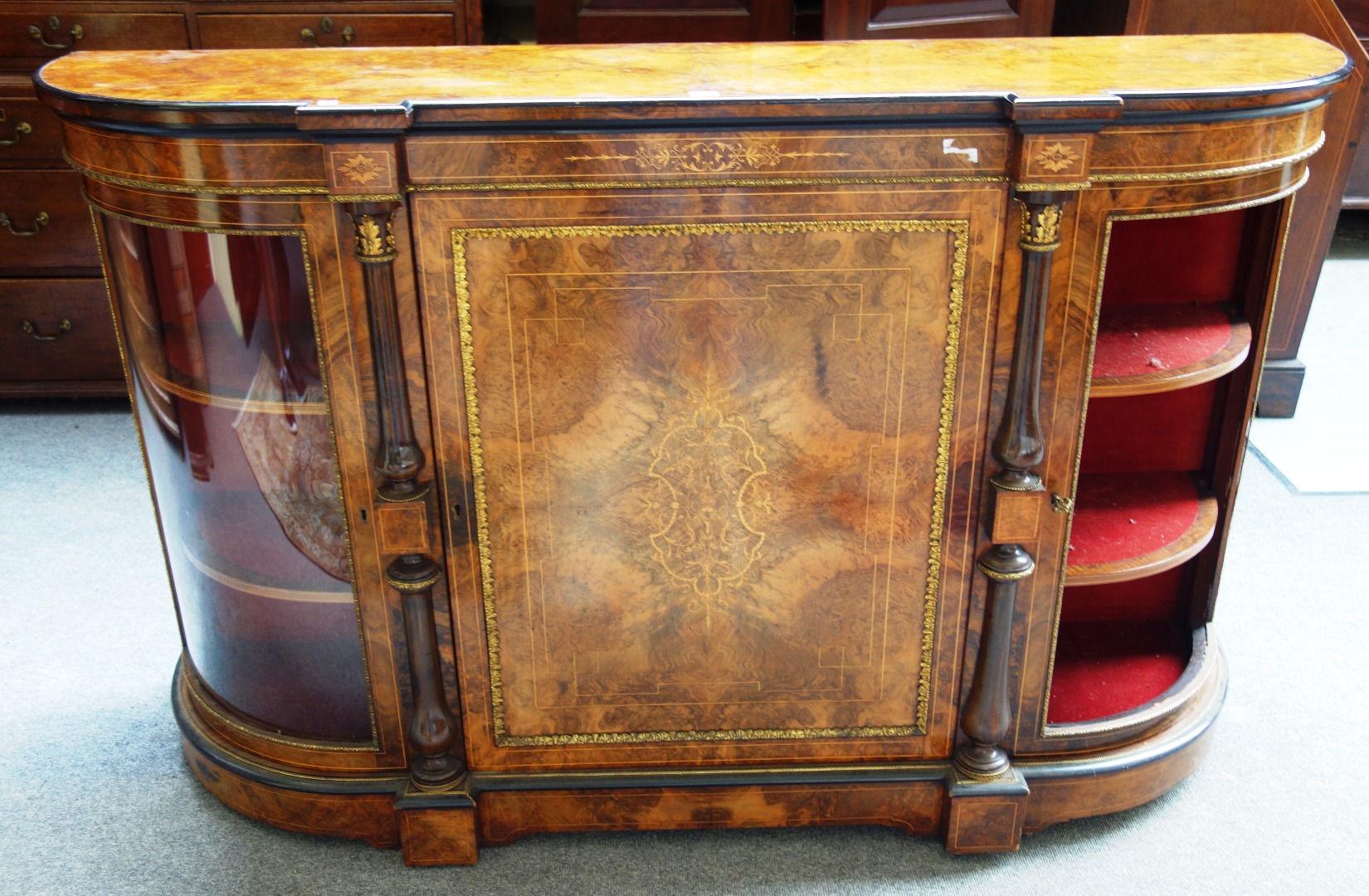 Appraisal: A Victorian gilt metal mounted figured walnut credenza the central