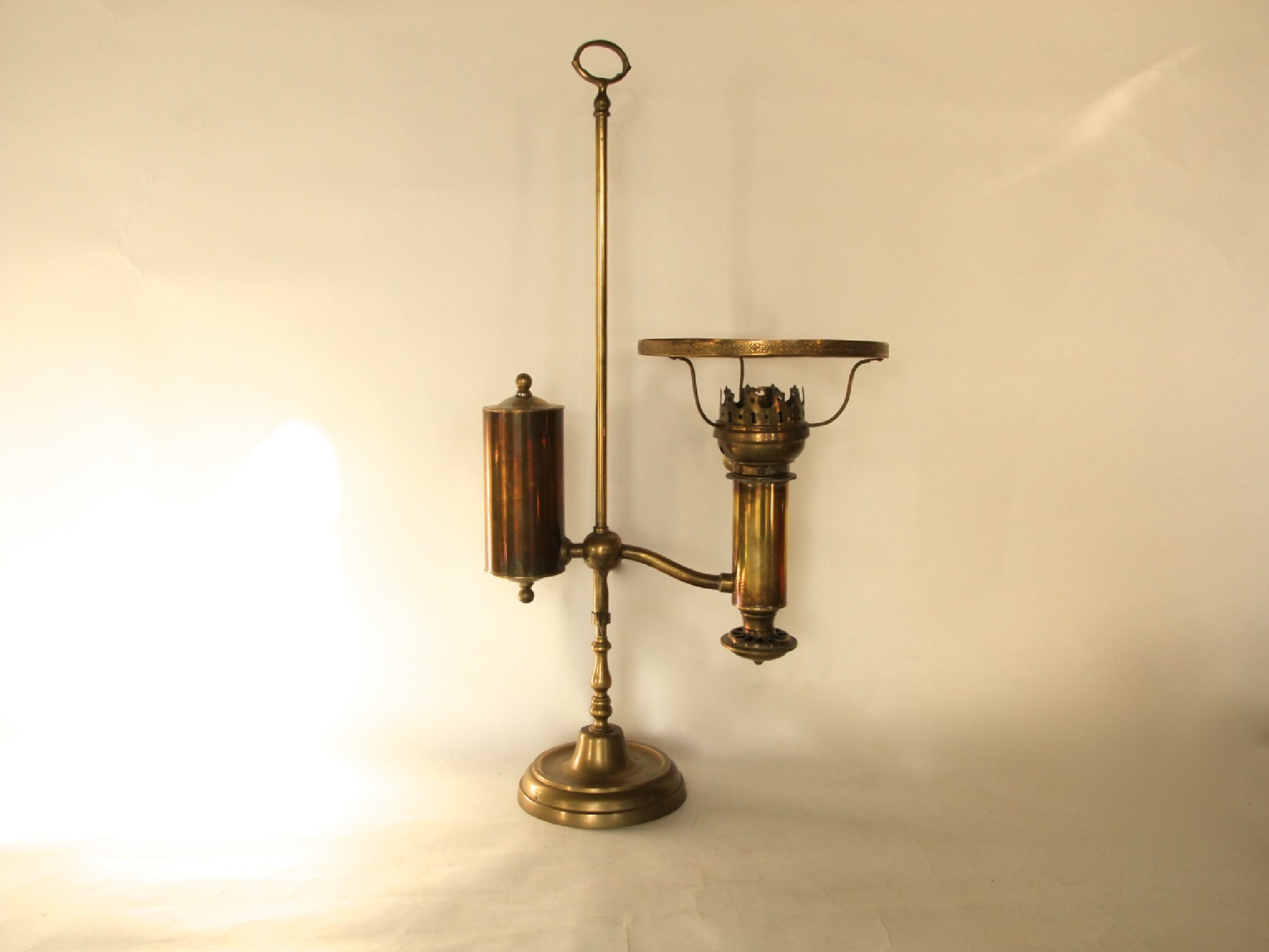 Appraisal: A Brass oil burning lamp converted to electricity with Hinks