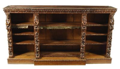 Appraisal: A Victorian oak breakfront open bookcase well carved with satyrs